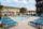 Resort style pool surrounded by lounge chairs