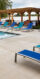 Resort style pool surrounded by lounge chairs