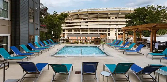 Resort style pool with a view of the stadium